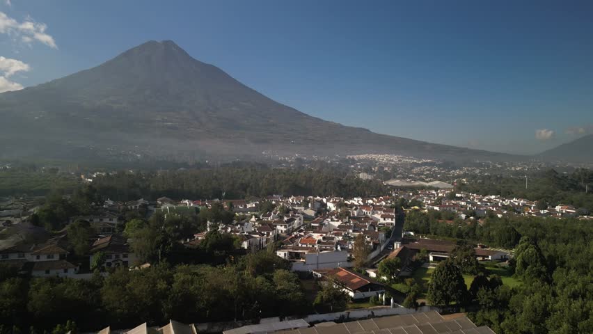 Aerial of Volcan Agua and homes in old capital city Antigua Guatemala