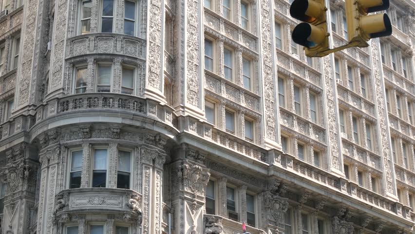New York City Manhattan Midtown historic building 1909, facade architecture, United States of America. Real estate property on 7 seventh avenue. Classic style design landmark. Corner symmetry, windows