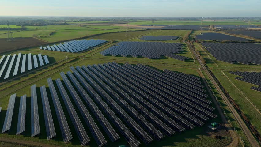 Aerial view of a major renewable energy farm in the UK countryside showcasing sustainable power plant technology and net zero carbon goals