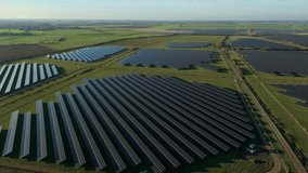Aerial view of a major renewable energy farm in the UK countryside showcasing sustainable power plant technology and net zero carbon goals - Powered by Shutterstock - Get 15% off with code: PIKWIZARD15