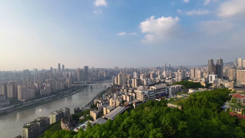 Timelapse cityscape of Chongqing China with dramatic clouds moving rapidly above dense urban skyline. Dynamic megacity atmosphere and architectural growth in southwestern China.