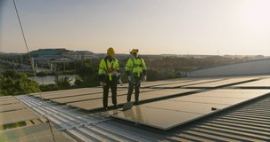 Professional engineers are inspecting solar panels on an industrial rooftop, focusing on renewable energy efficiency, industrial safety compliance, and sustainable growth. - Powered by Shutterstock - Get 15% off with code: PIKWIZARD15