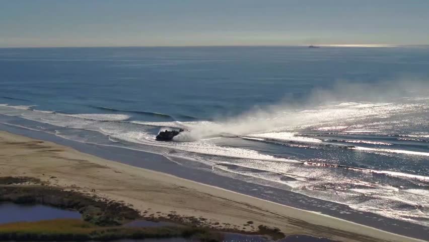U.S. Marines and Sailors Transport Amphibious Combat Vehicles to the Beach