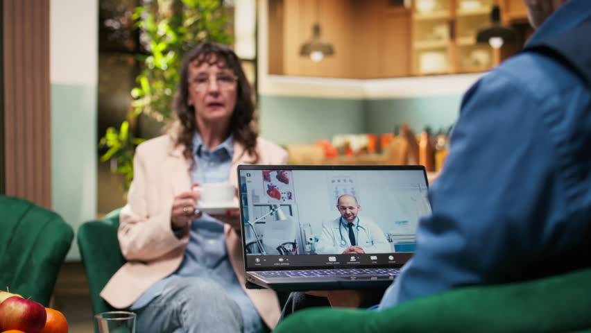 Elderly people on video call with physician discussing diagnosis and medication, telehealth consultation supports remote healthcare and treatment guidance. Quality of life and safety for old age.