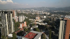 Aerial panning above zona 14 in downtown Guatemala City mountains and skyscrapers - Powered by Shutterstock - Get 15% off with code: PIKWIZARD15