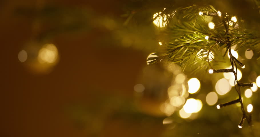 A captivating close-up of sparkling lights on a beautifully decorated Christmas tree.