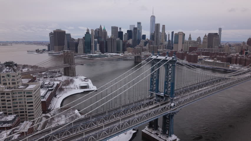 winter flying overManhattan Bridge towards view of downtown NYC