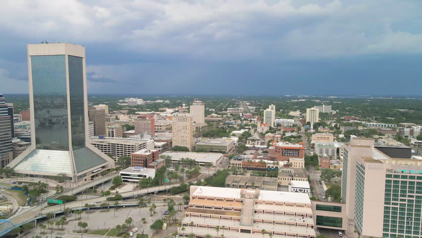Cinematic aerial daytime drone shot of downtown Jacksonville skyline and cityscape, Florida, USA.
