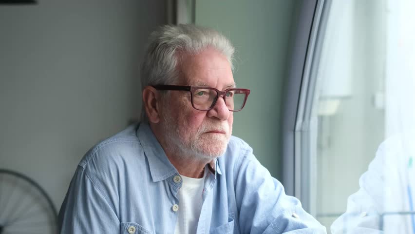 Face of senior caucasian hoary man looking away deep in sad thoughts feels lonely close up portrait, recollect memories and life moments, depressed grandfather alone indoors, yearning for wife concept
