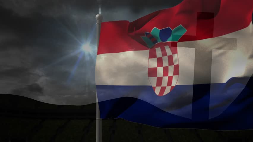 National flag on pole fluttering, folding and rippling from gusts, shield tucking and reappearing. Ensign, crest, outdoors, editorial, backlight, cinematic, stock