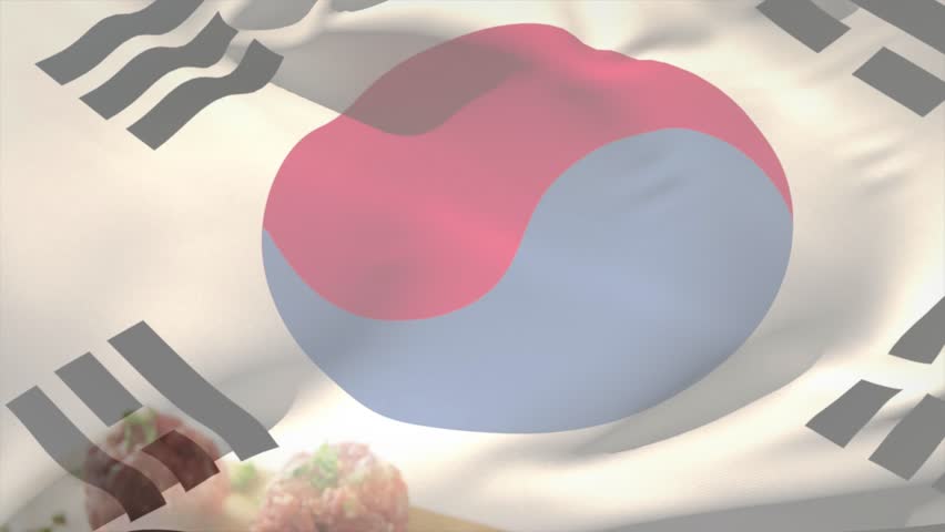 Taegukgi overlay appearing then rippling and folding over tabletop, revealing three pink rice balls. Flag, translucent, stilllife, cuttingboard, wooden, studio, fabric