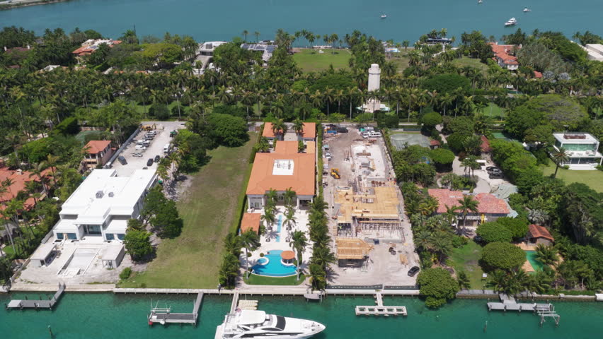 Waterfront residential area on Star island, Miami. Florida landscape view. Star Island in Miami beach, Florida. Residential buildings in luxury Star island surrounded by sea. Ocean views.