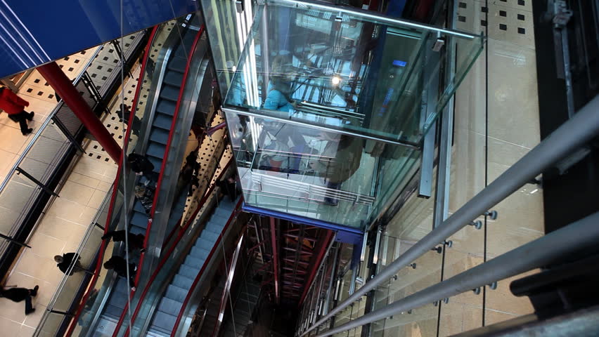 Customer uses elevator to get downstairs in shopping mall / HD1080 / 30fps