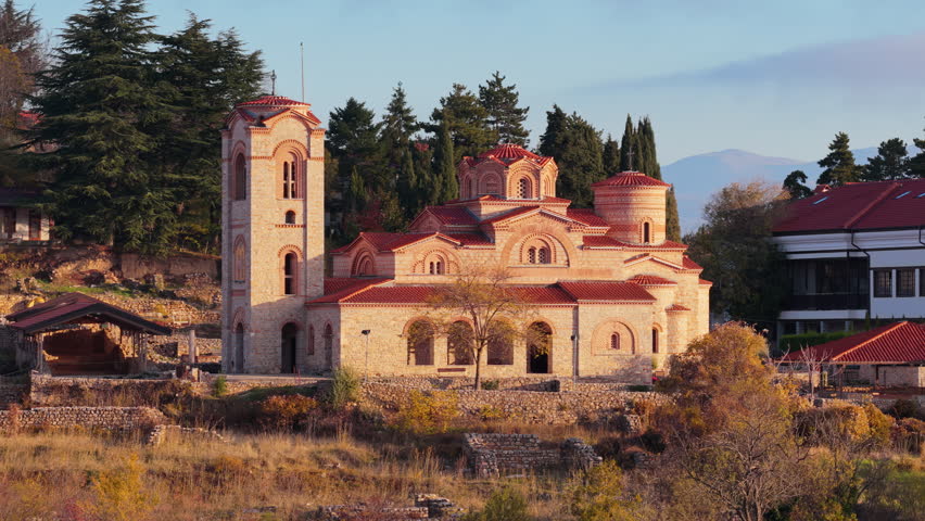 Aerial drone view of the restored St. Clement and Panteleimon Church at Plaosnik, showcasing its Byzantine architecture surrounded by historical ruins. Ohrid, North Macedonia