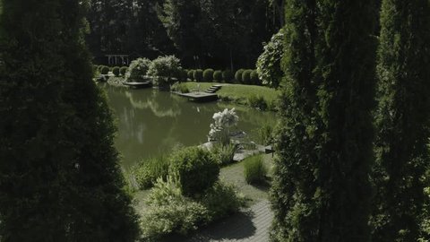 Drone Descending toward Lakeside Installation