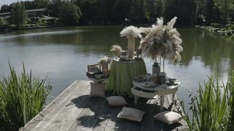 Close Drone Rotation by Lakeside Table Setup