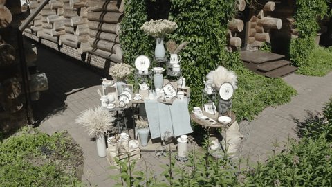 Drone Circling Decor Installation by Log Facade