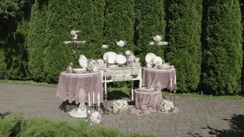 Aerial View of Elegant Outdoor Table Setting with Floral Decor