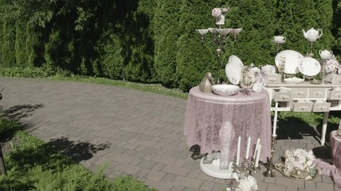 Elegant Outdoor Tableware Display with Floral Accents