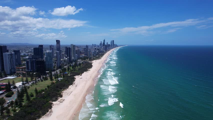 Skyline Along Sandy Broadbeach On A Sunny Day In Queensland, Australia. wide aerial shot