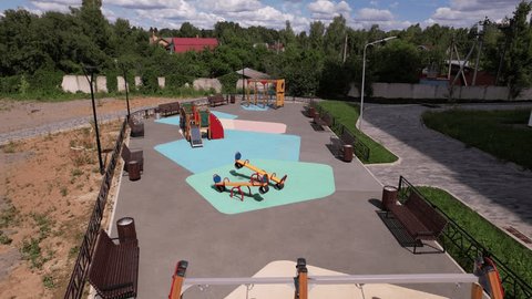 Drone Flying Forward above Playground