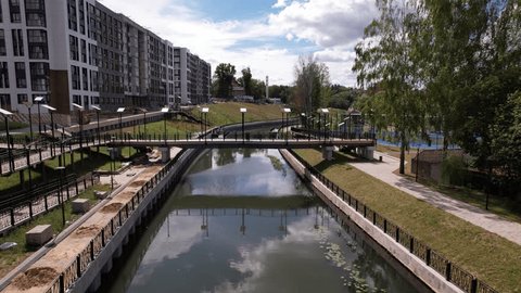 Drone Flying Low over Residential River