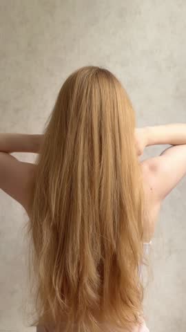 Home care for long hair: blow-drying, combing.
Beautiful blonde women
