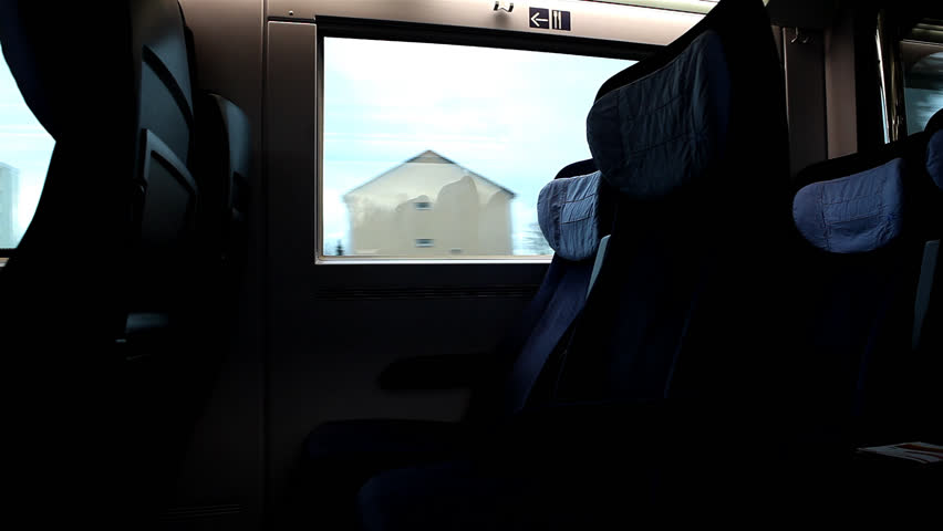 Empty seats in fast moving train with houses and trees passing by / HD1080 /