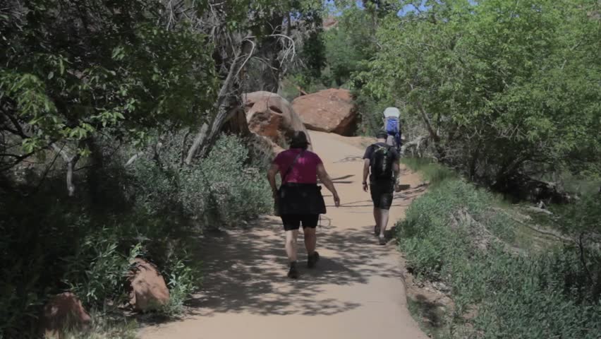 A family hiking through Zion National Park
