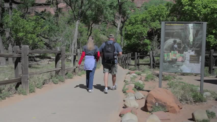 A family hiking through Zion National Park