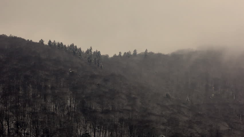 Winter landscape with snow and clouds laying over Hills HD1080 / 30fps 