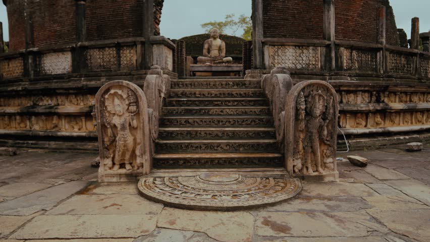 Stone steps with moonstone carvings leading to Buddha statue at Vatadage temple in Polonnaruwa, Sri Lanka