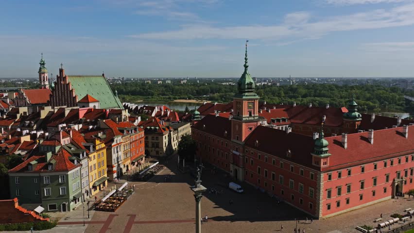 Drone orbit revealing Royal Castle Square and Vistula River, Warsaw Old Town