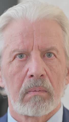 Close up of Surprised Old Man Face, vertical video
