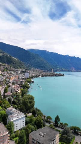 Montreux town located on the shores of Lake Geneva in Switzerland aerial drone vertical video