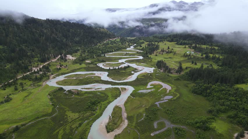 Aerial Forward Push Over Meandering River and Alpine Meadow in Western Sichuan China
