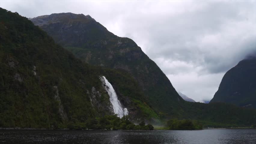 Milford Sound Lady Bowen Falls Piopiotahi Ata Whenua Milford Sound Southern Alps South Island Fjord Fiordland National Park Cruise boat New Zealand Aotearoa Spring morning Freshwater Basin landscape
