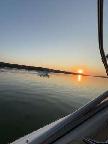 Sunset view from boat on peaceful water horizon — cinematic background for lifestyle content