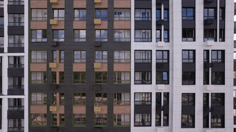 Drone Side Flight Past Modern Apartment Buildings