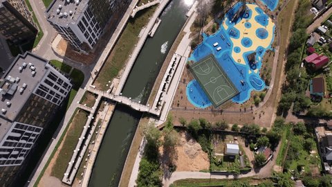 Forward Drone Descent above River Embankment