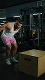 Focused male athlete performing dynamic box step-up exercise in a modern gym, moving from setup to elevated position to develop leg strength, balance, stability, and explosive power during training - Powered by Shutterstock - Get 15% off with code: PIKWIZARD15