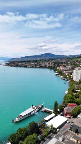 Panoramic view of Montreux resort town on Lake Geneva Switzerland aerial drone vertical video