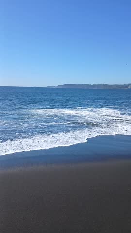 Waves on a beach in southern Chile in summer
