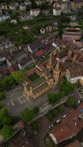 Collegiate Church of Neuchâtel Romanesque and Gothic architecture aerial vertical video Switzerland