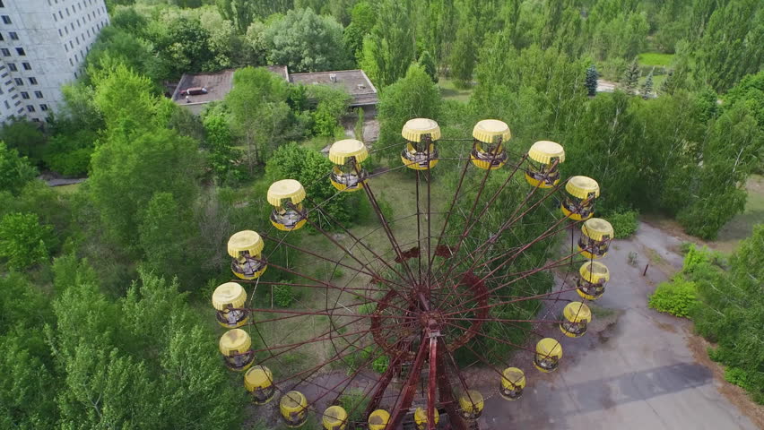 Aerial view of the abandoned Ferris wheel in Pripyat, Ukraine. Rusted and overgrown, a symbol of the Chernobyl disaster.