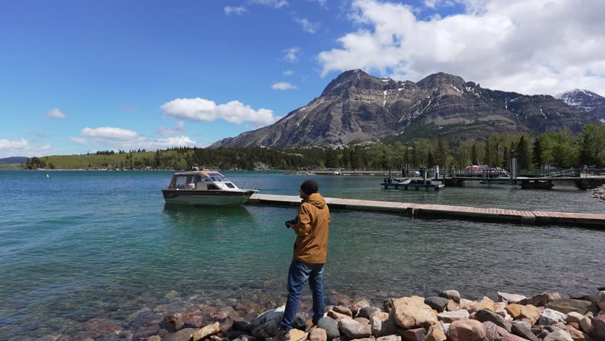 Man relaxing by Emerald Bay in Waterton Lakes National Park
