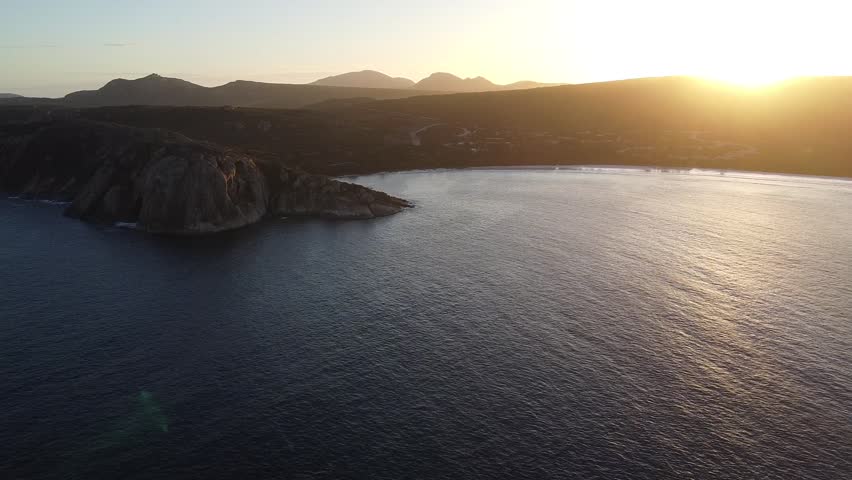 Close-up aerial drone footage of Lucky Bay in Cape Le Grand National Park, Western Australia, showcasing vivid turquoise water meeting pristine white sand. Detailed coastal landscape highlighting crystal clear ocean textures and the iconic brilliance of this Australian beach.
