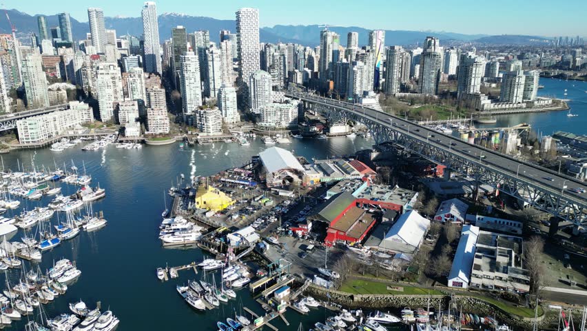 Granville Island in vancouver drone aerial on sunny day and granville bridge
