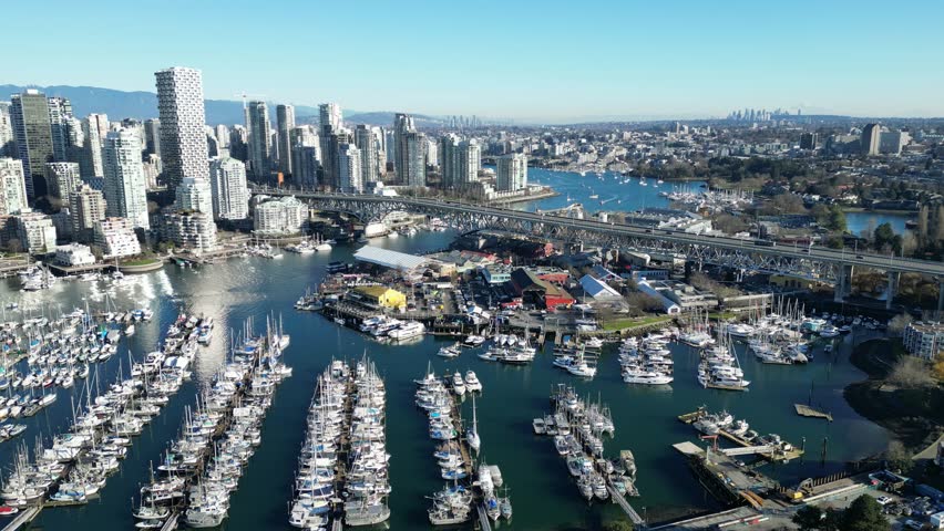 Granville Island in vancouver drone aerial on sunny day and granville bridge