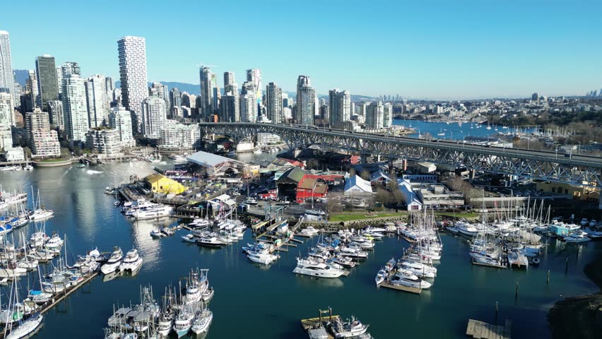 Granville Island in vancouver drone aerial on sunny day and granville bridge